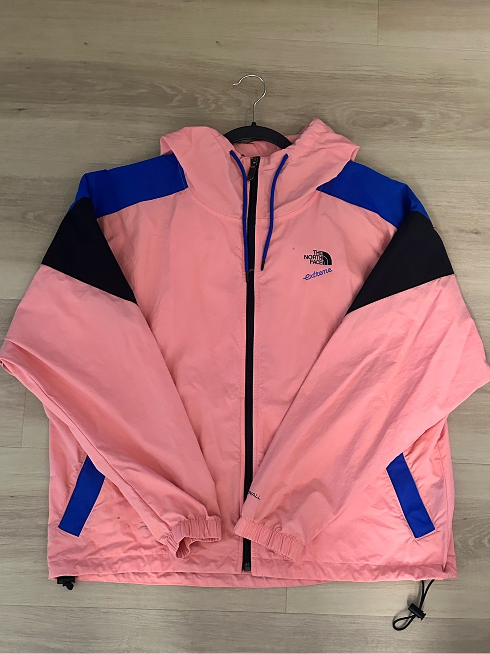 The North Face Coral Pink Hooded Windbreaker with Blue Accents